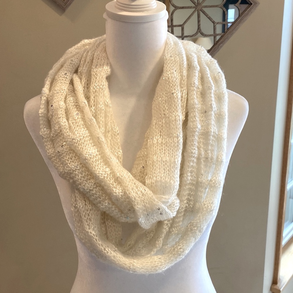 Cream color infinity scarf with tiny silver sequins.
